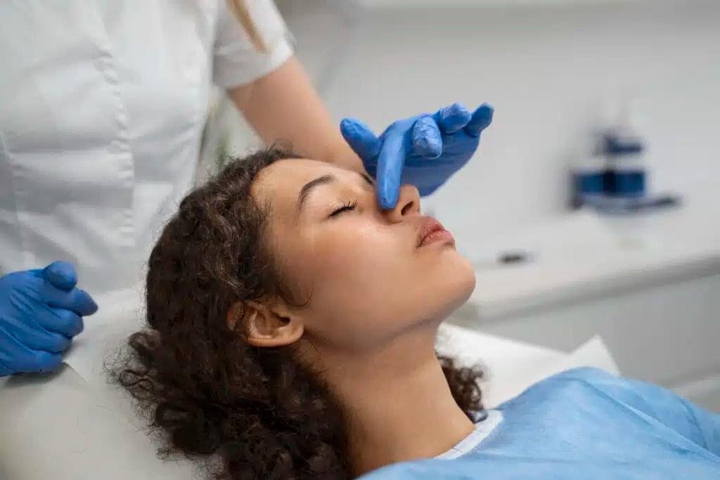 non-surgical rhinoplasty filler treatment performed by aesthetic practitioner
